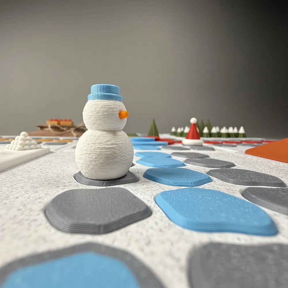 Closeup of a 3d printed board game including snowmen