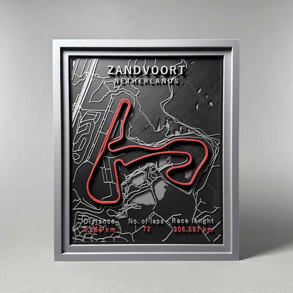 Framed map of Zandvoort circuit with red track layout on a gray background