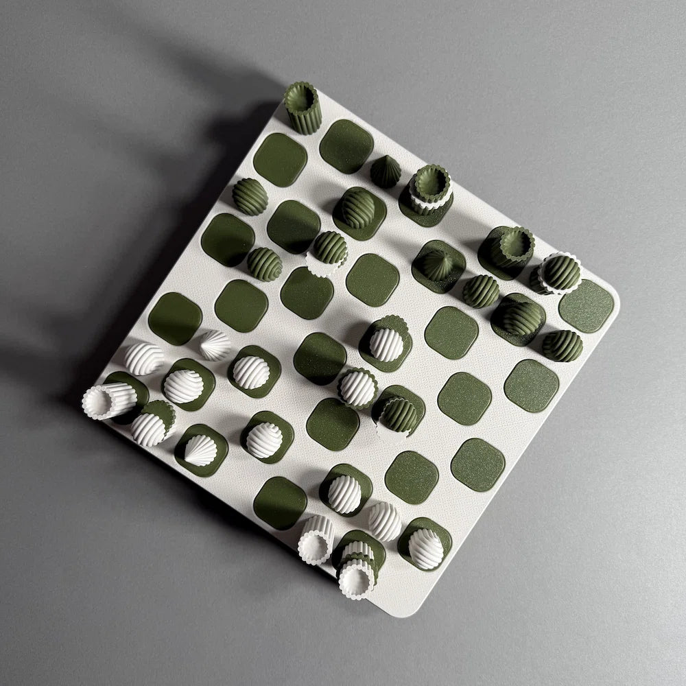 A chess board with white and green figures