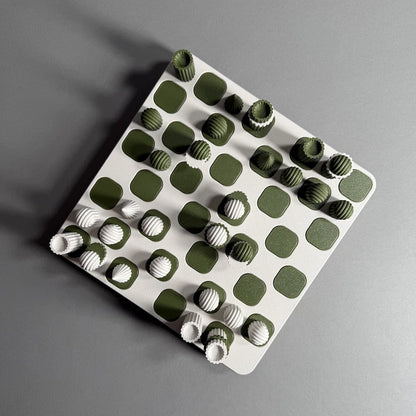 A chess board with white and green figures